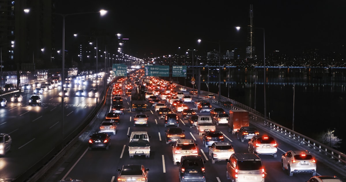 Cars on a city road at night